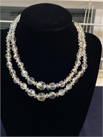 Crystal three strand necklace with one strand