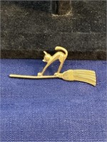Gold tone brooch cat and broom