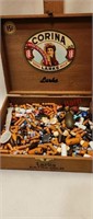 Wooden cigar box full of stone beads
