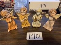 3 matching angel figurines and 1 porcelain angel