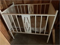 Old white baby bed