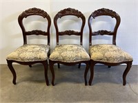 Three carved side chairs