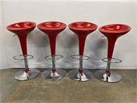 Set of four bright red adjustable barstools
