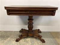 Carved mahogany game table