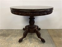 Carved center table with black marble top