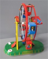 Old metal mechanical Ferris wheel toy.
