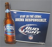 Tin Bud Light sign. Measures: 23" H x 23.25" W.