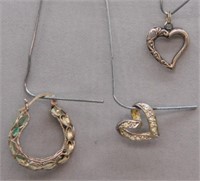 Sterling Silver heart pendant and single earring.