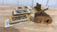 Stereoscope (missing one lens) and cards