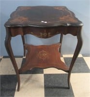 Antique parlor lamp table with pencil legs.
