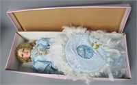 Porcelain doll in box. Measures: 25" Tall.