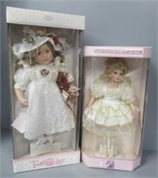 (2) Porcelain dolls in boxes.