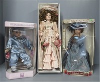 (3) Porcelain dolls in boxes.