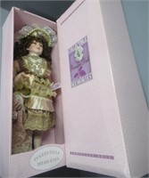 Porcelain doll in box by Collectable Memories.