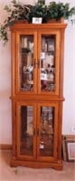 Oak lighted curio cabinet w/ glass shelves,