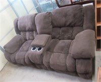 Dual recliner with cup holders.