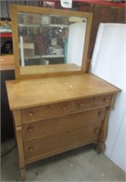 Vintage 4 drawer dresser with beveled mirror.