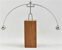 Metal Balancing Man Toy on Wooden Block