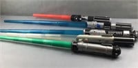 5 toy star wars light sabers, some parts / pieces