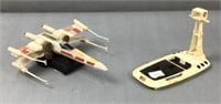 Plastic Star Wars x-wing model and space sled