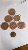 (6) 1 oz fine copper rounds and (1) 1/2 oz copper