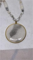 Glass bead necklace, engraved design on medallion