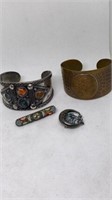 Group of native style cuffs and brooch pins