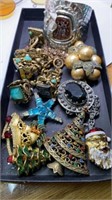 Group of assorted jewelry and Christmas brooches