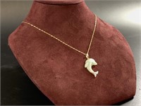 14 kt Gold and diamond necklace with a dolphin pen