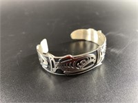 Sterling silver Tlingit bracelet depicting several