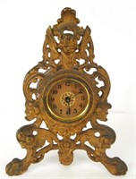 Cast iron antique dresser clock with Cherub