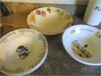 Large bowls and decor items on shelf