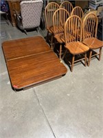 Wooden dining room table with 6 chairs. Table