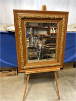 Hanging mirror with wood frame, dimensions are 26