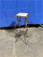 Marble topped metal end table. Approximately 29”