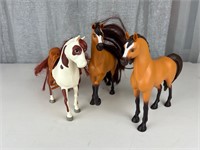 Three plastic horses
