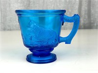 Antique Wolf embossed glass cup depression
