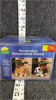 handcrafted stand- dog on left