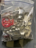 bag of metal and plastic cookie cutters