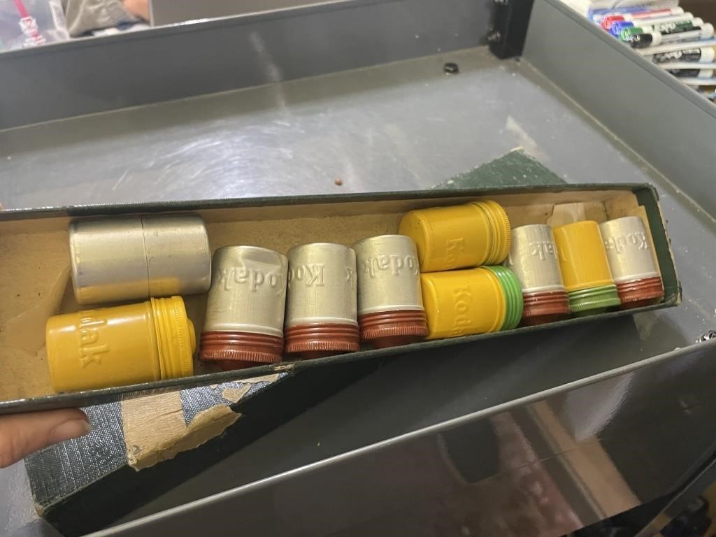 box of canisters of film, the torch is passed