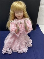 Praying porcelain doll