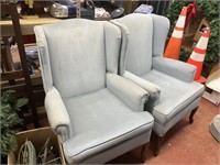 2 light blue arm chairs