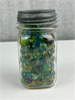 Jar of vintage glass marbles