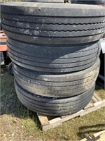 121) Four 11R225 tires