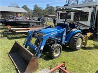 1208) New Holland TC33D front end loader, backhoe,