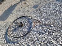 4'5"  steel wagon wheel made into a yard trellis