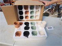 Case of 24 small flower pots.