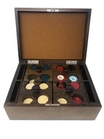 Vintage poker chips in wooden caddy box