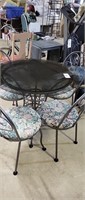 Glass top patio table with 4 chairs