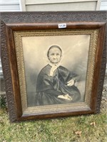 Picture of elderly woman in carved frame